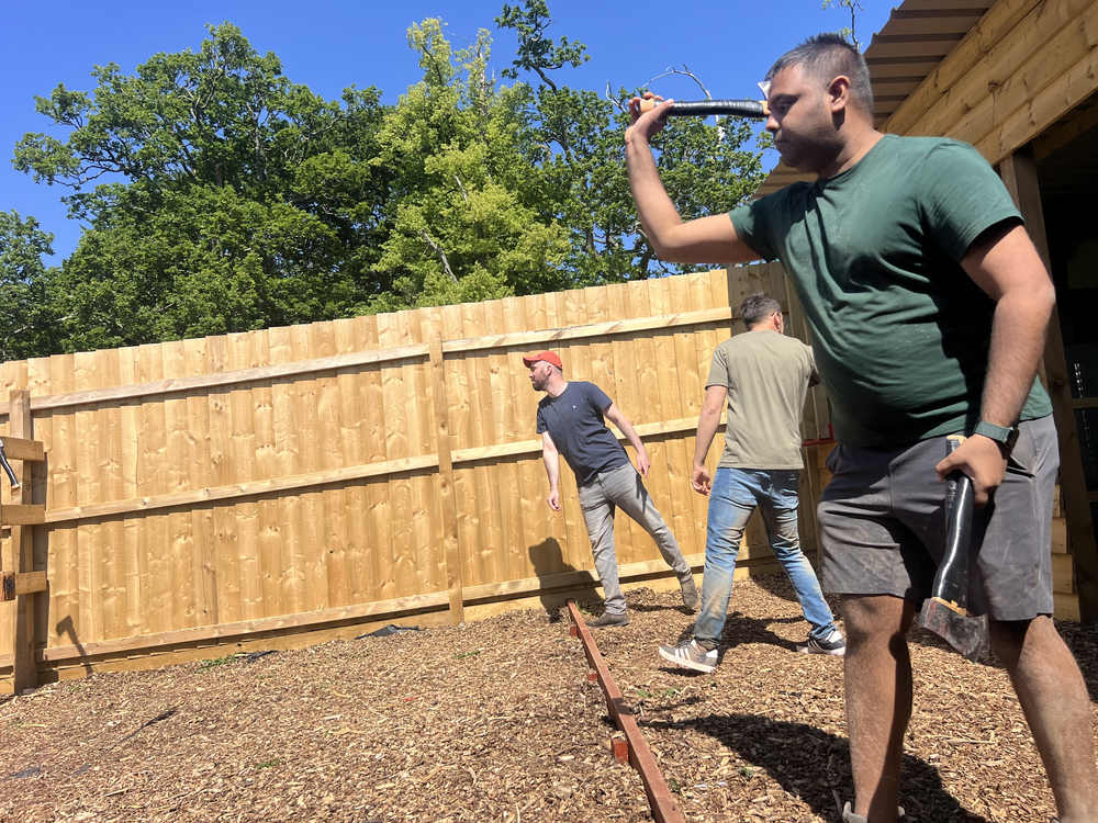 Participant preparing to throw an axe at Devon Activity Centre