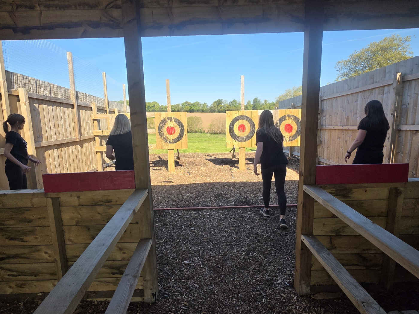 Group taking turns in the sheltered throwing lanes